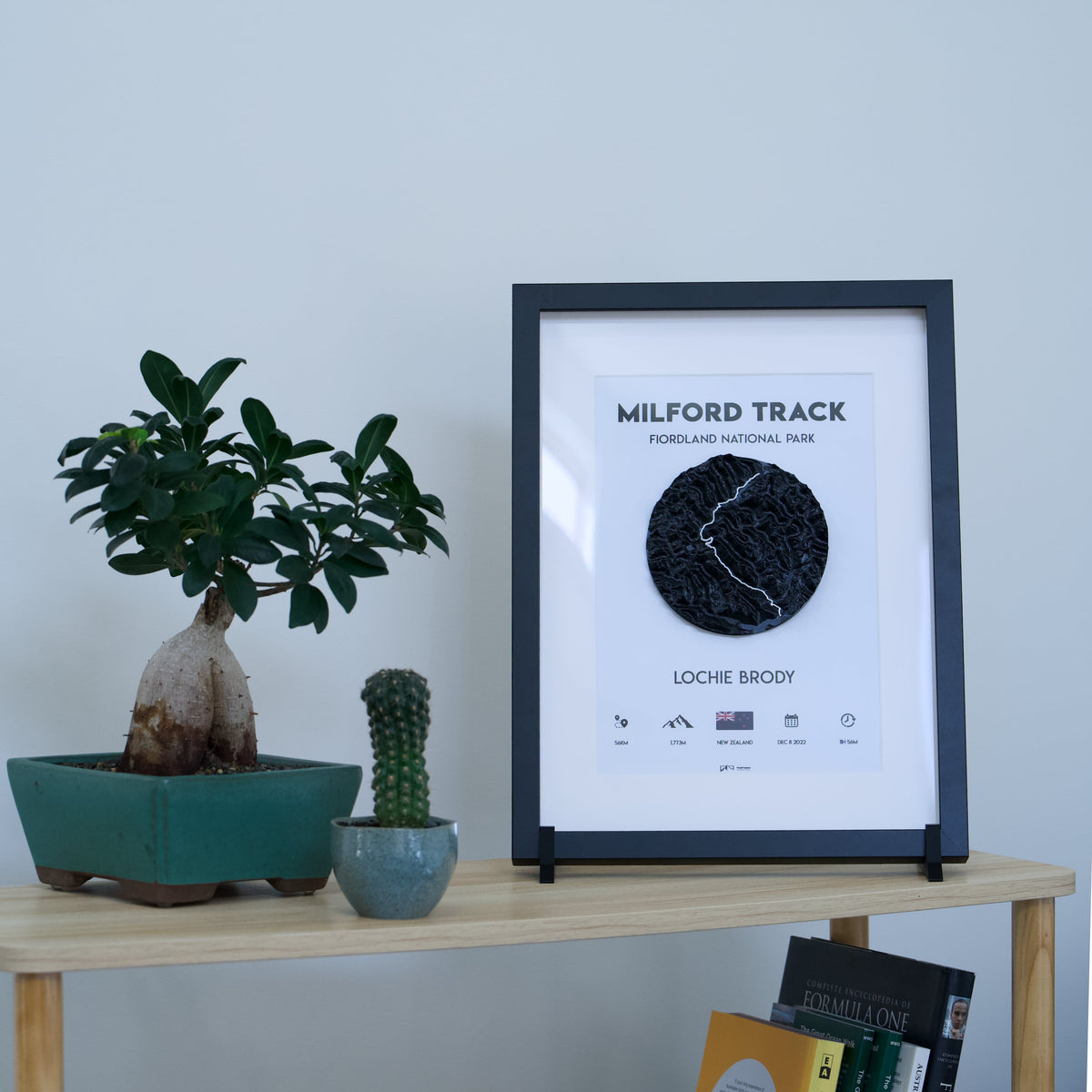 3D-printed framed adventure map — black frame, black tile