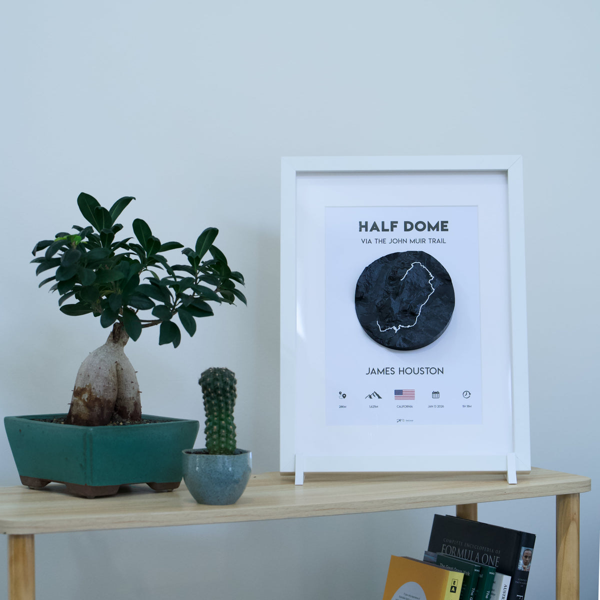 3D-printed framed adventure map — white frame, black tile